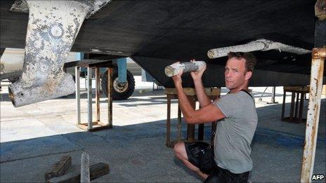Shane Dillon, captain of the Saoirse, shows the damage on his ship in the Turkish port of Gocek, June 30, 2011