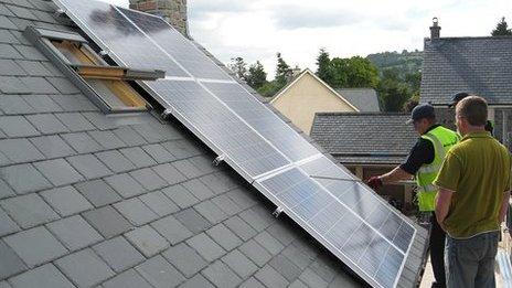 Solar panels being fitted to a home