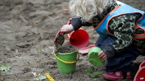 Child plays outside at Egalia pre-school in Stockholm
