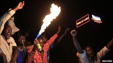 People take part in South Sudan"s independence day celebrations near the countdown clock in Juba on 9 July 2011