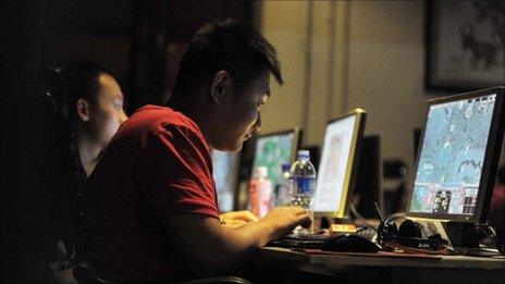 People at an internet cafe in Beijing, May 12, 2011