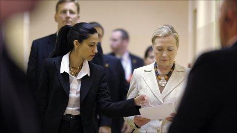 Hillary Clinton with aide Huma Abedin, and rear left security chief Kurt Olsson