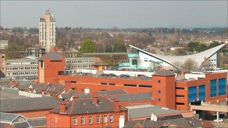 Wrexham's high-rise police station and the sloped-roof of the Waterworld swimming baths