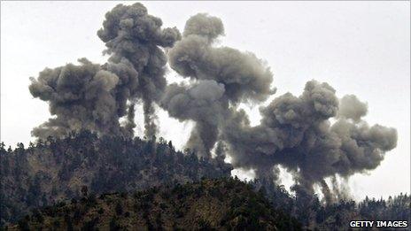 An explosion rocks al-Qaeda positions in the Tora Bora mountains after an attack by US warplanes on 14 December 2001
