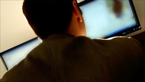 Man looking at computer screen