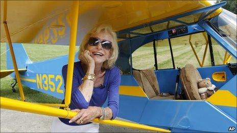 Myrtle Rose stands by her plane in Chicago, Illinois, on 5 August 2011
