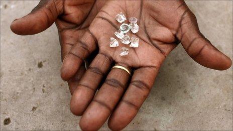 An illegal Zimbabwean diamond dealer holding gems from Zimbabwe - (Photographed in Manica in Mozambique, near Zimbabwe's border, September 2010)