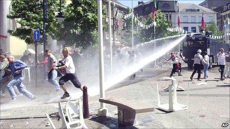 Water cannon being used to disperse football fans in Charleroi in 2000