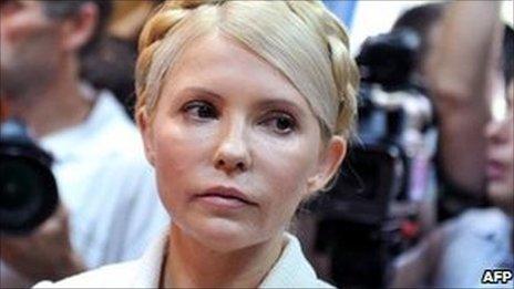 Ukraine's ex-Prime Minister Yulia Tymoshenko look on at the beginning her court hearing in Kiev on 24 June 2011