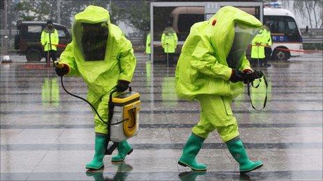 Emergency service personnel in chemical protection clothing participate in an anti-terror drill as part of a joint US-South Korean military exercise, Ulchi Freedom Guardian, in Namyangju, east of Seoul, on Tuesday