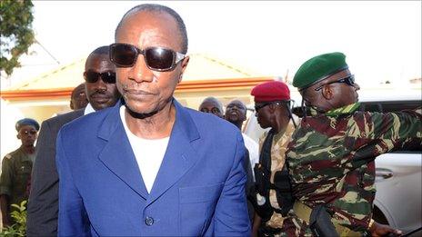 Guinea's President Alpha Conde arrives at his home in the capital, Conakry, after his victory in elections last year