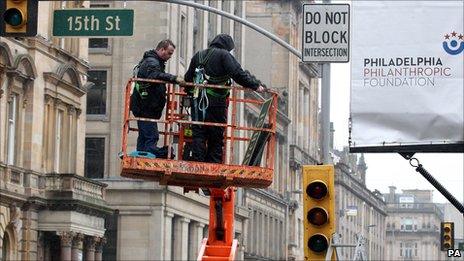 American street signs and traffic lights are put up as preparation continues for the filming of World War Z in George Square, Glasgow