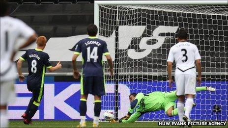Swansea City goalkeeper Michel Vorm saves BEn Watson's penalty