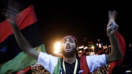 Tens of thousands of Libyans celebrate the arrest of Col Gaddafi's son, Saif al-Islam, and the partial fall of Tripoli into the hands of the Libyan rebels on 21 August 2011 in Benghazi, Libya