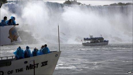 Tourist boats and the Maid of the Mist passenger ship in Niagara Falls, Ontario