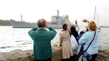 Family and friends at Devil's Point in Plymouth waving off HMS Scott