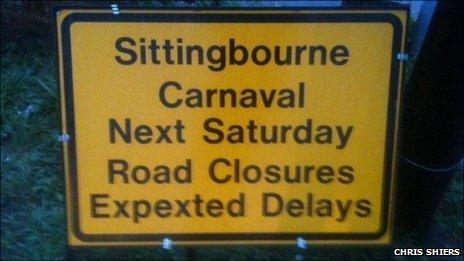 Signs warning motorists about 'Carnaval' traffic delays