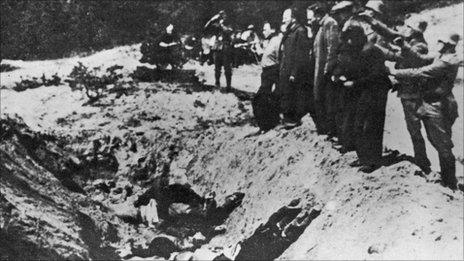 1941. Nazi Commanders line up Jews to shot them and and push them into the Babi Yar ravine.