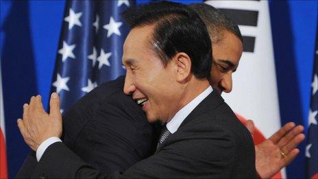 US President Barack Obama embraces South Korean President Lee Myung-bak