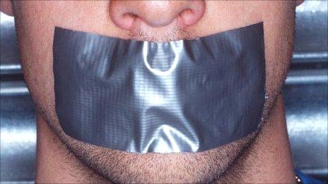 Mouth with tape over it