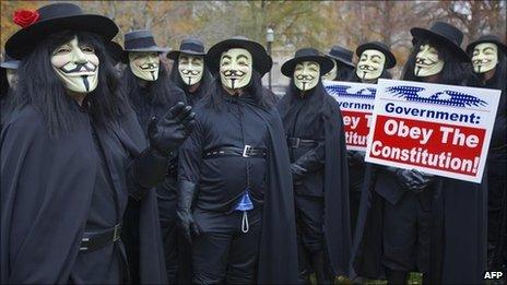 Protesters with 'We the People Foundation for Constitutional Education' dress in the costume of V in November 2006 in Washington, DC