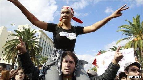 People chant slogans during a demonstration against hardline Islamists in Tunis on 16 October