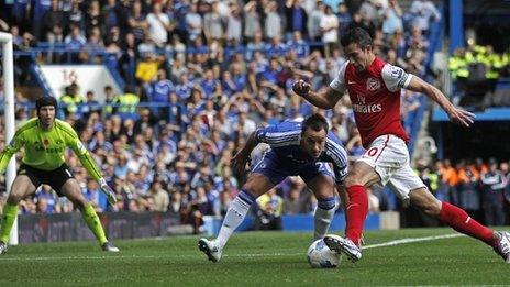 Arsenal's Robin van Persie takes on Chelsea's John Terry