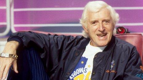 Jimmy Savile in a chair