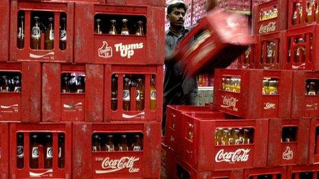 Coke bottles being stocked