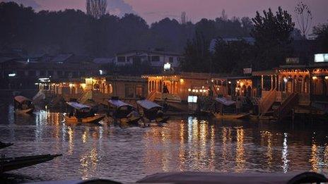 Kashmiri gondolas carrying tourists in Kashmir's famed dal lake in Srinagar