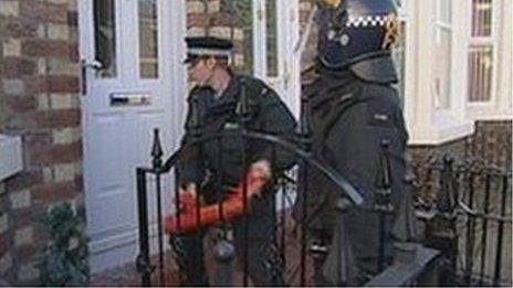 Police force their way into a home