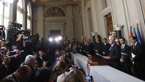 Italian Prime Minister designate Mario Monti (right) talks to reporters at the end of a meeting with Italian President Giorgio Napolitano at the Quirinale Palace in Rome - 16 November 2011
