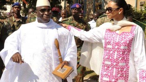 President Yahya Jammeh (L) speaks with his wife, Zeineb Souma Jammeh, on 24 November 2011 as he leaves a polling station in the capital Banjul