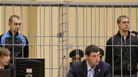 Dmitry Konovalov (L) and Vladislav Kovalyov (R), standing inside the defendant cage in the Supreme Court in Minsk, 15 September 2011