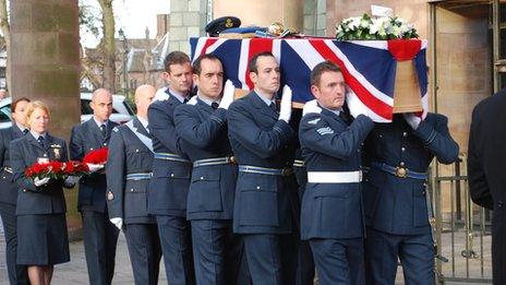 Members of the RAF carry the coffin into Coventry Cathedral