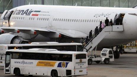 Iranian diplomatic staff board a plane at Heathrow Airport, in London