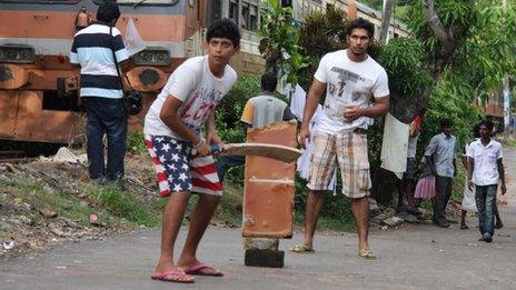 Sri Lankans playing cricket