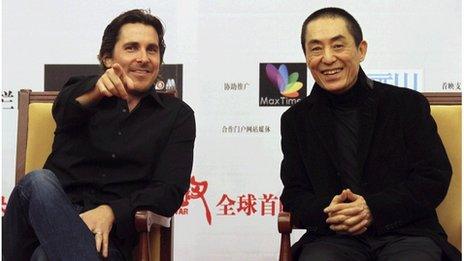 British actor Christian Bale (L) and Chinese director Zhang Yimou attend the premiere of "The Flowers of War" in Beijing December 11, 2011