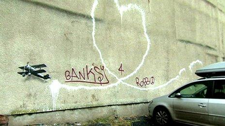 Artwork attributed to Banksy is grafittied