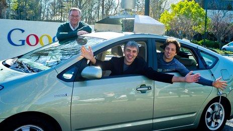 Google's executive team with one of their self-drive cars