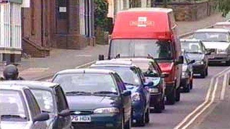 Vehicles travelling through Long Stratton, Norfolk