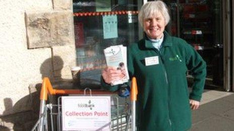 A North Lakes Foodbank volunteer raises publicity about the scheme