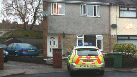 A police car parked outside the house in Llantwit Fardre, near Pontypridd