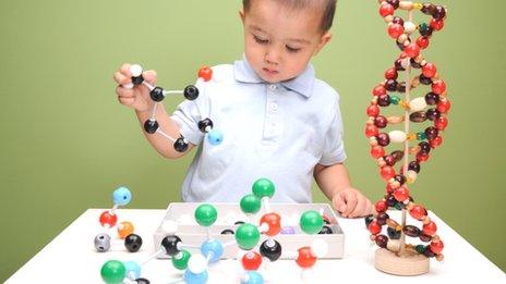 Boy building molecular structures