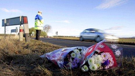 flowers by road crash site