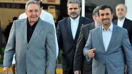 Cuban President Raul Castro (left) and Iranian President Mahmoud Ahmadinejad (right) walk at Jose Marti airport, on 12 January before the departure from Cuba of Iranian President Mahmoud Ahmadinejad after an official visit to Cuba