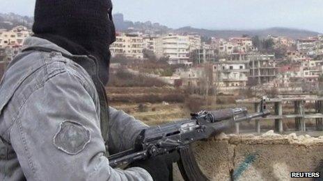 Purported photo of member of the Free Syrian Army on guard in the town of Zabadani (16 January 2012)