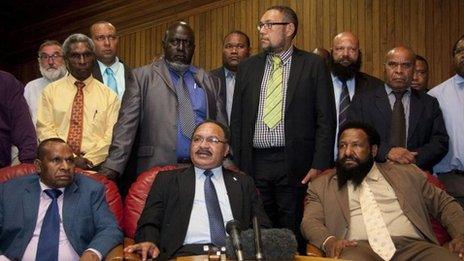 Peter O"Neill, front centre, at a press conference in Port Moresby on 15 December, 2011