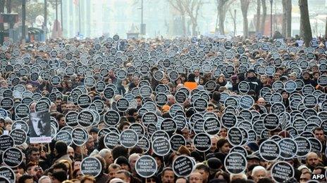 Marchers carry placards reading "We are all Hrant, we are all Armenian" in Istanbul, 19 January