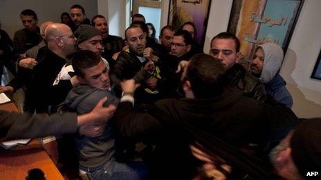 Relatives of Khaled Abu Arafah and Mohammed Totah scuffle with police inside the compound of the International Committee of the Red Cross (ICRC) in East Jerusalem (23 January 2012)